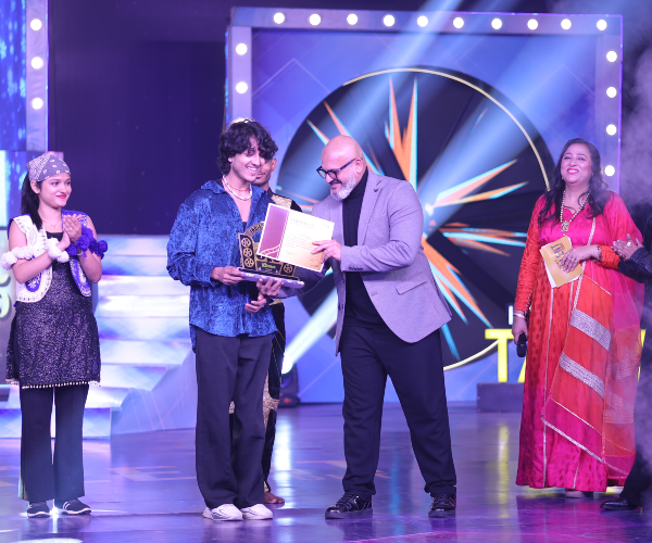Live studio audience cheering and applauding for contestants on India's Talent Fight Reality Show