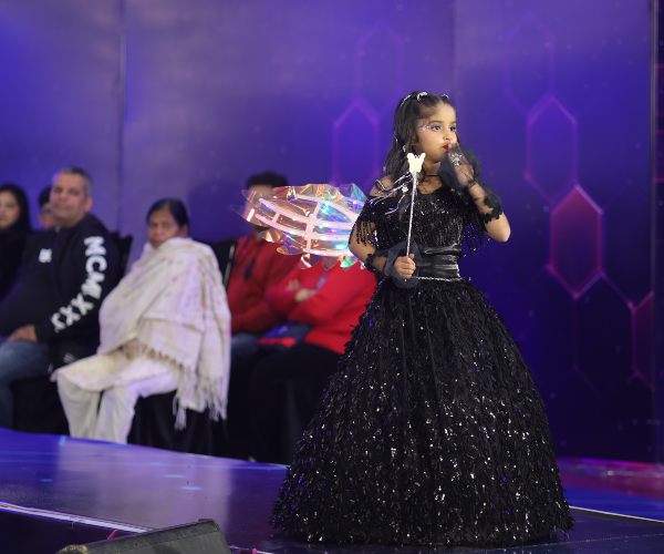 Contestant in single spotlight performing live on India's Talent Fight stage