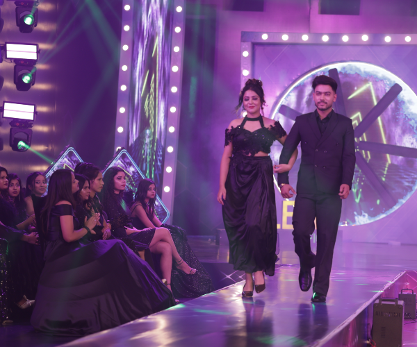 Wide shot of India's Talent Fight television production stage with judges and full audience